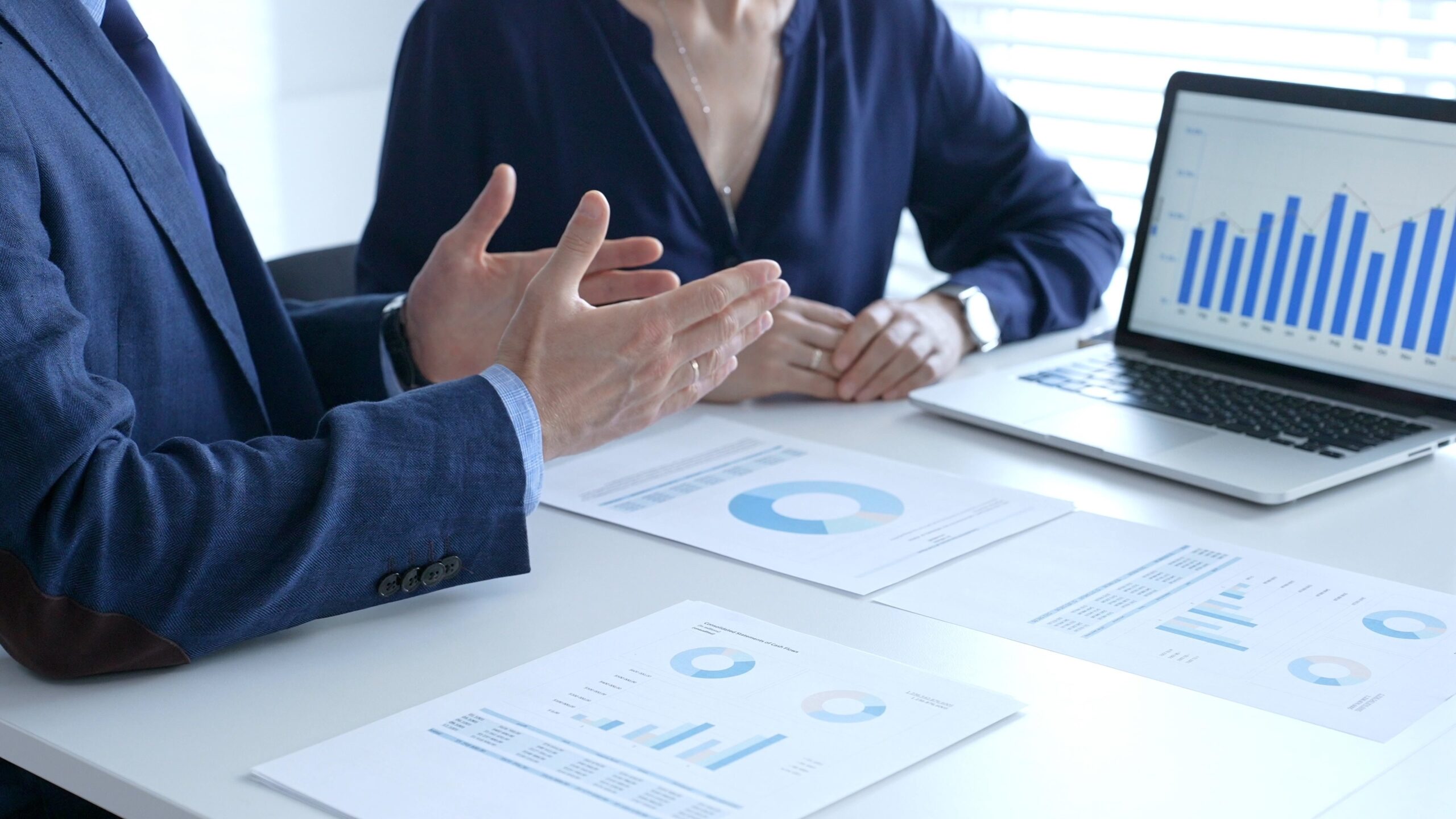 Businessman and businesswoman reviewing financial documents